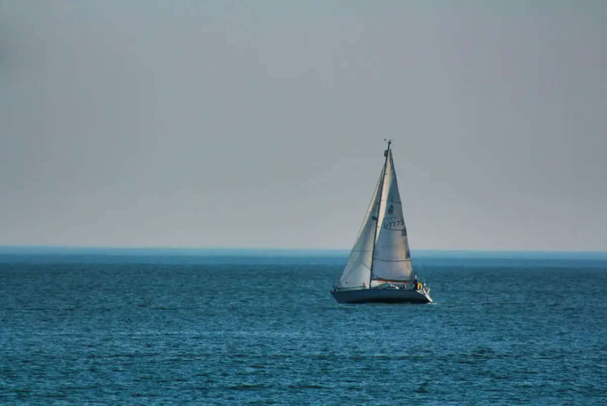 A sailboat alone on the horizon off Martha's Vineyard